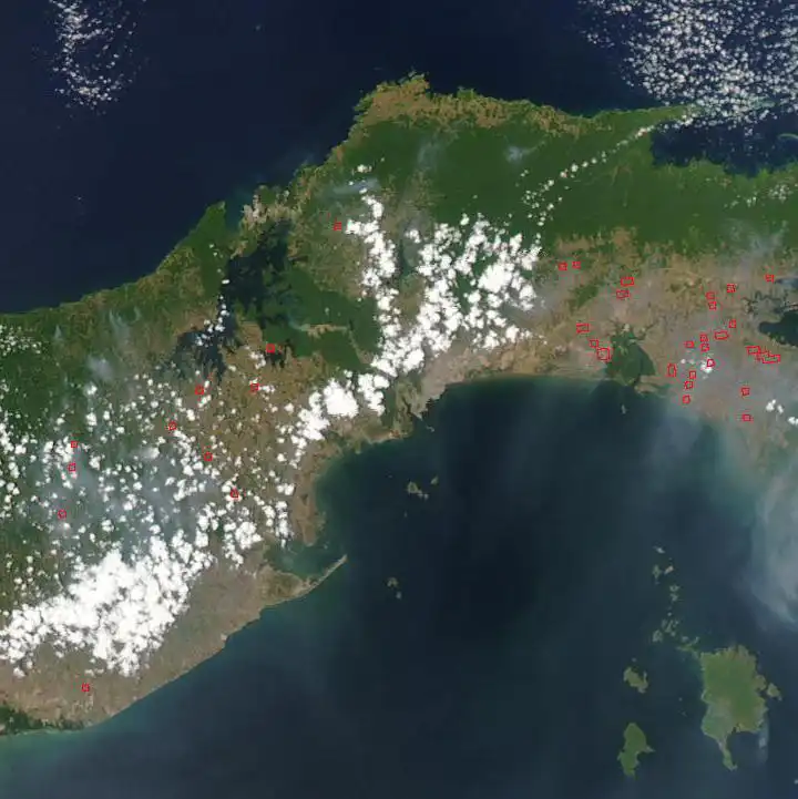 Satellite image showing the location of the Panama Canal: dense jungles are visible in green, topped by clouds.