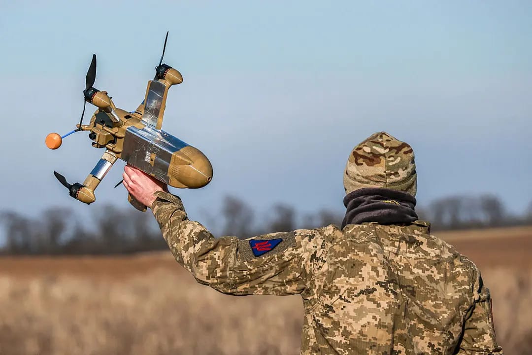 A Ukrainian military personnel with an interceptor drone