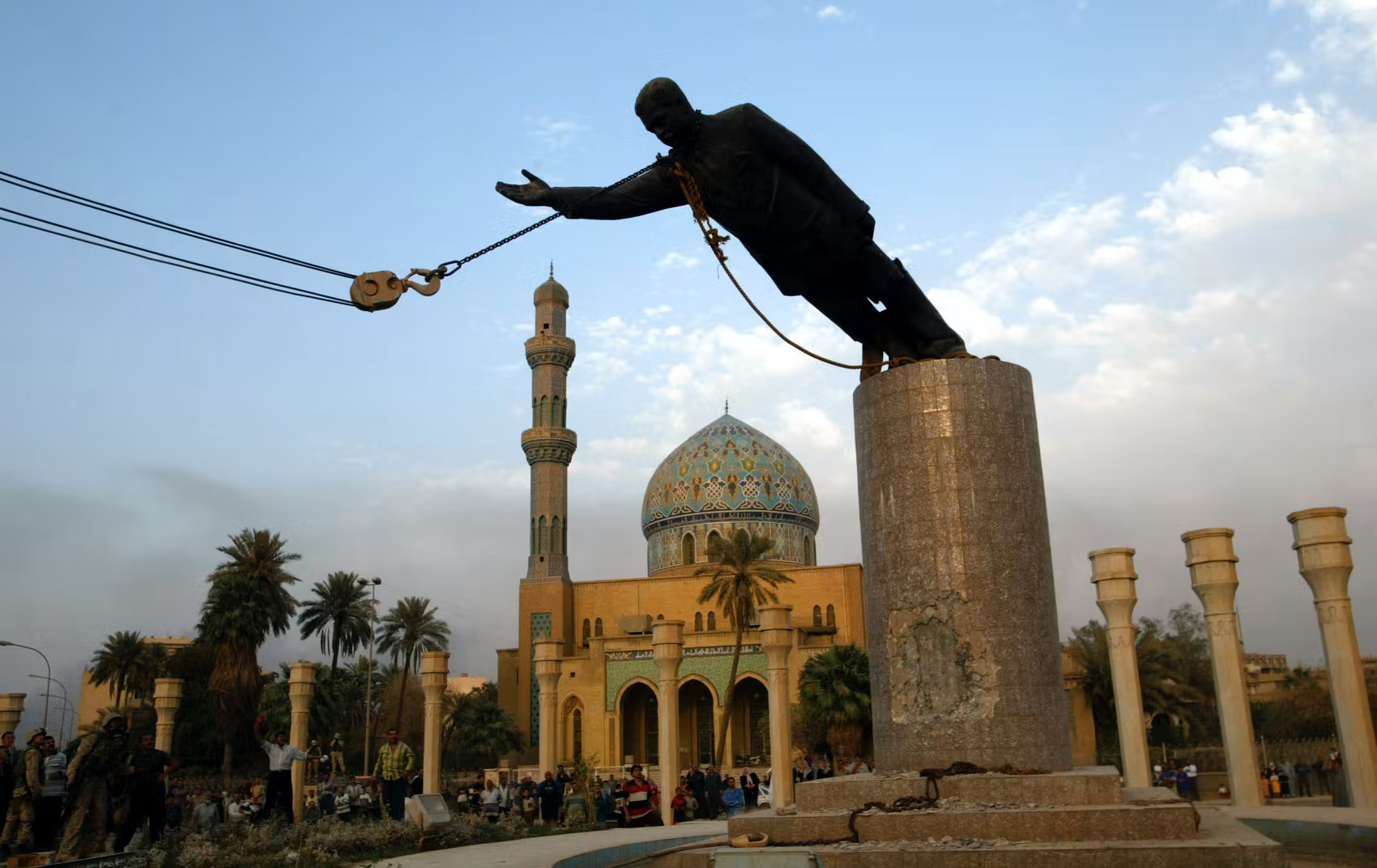 Statue of Saddam Hussein being toppled in Firdos Square after the US invasion of Iraq