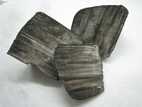 Lithium ingots with a thin layer of black nitride tarnish

